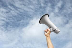 side-view-hand-holding-megaphone-300x200.jpg