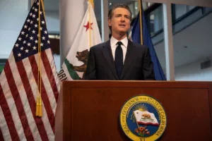 Governor Gavin Newsom speaking at a press event.