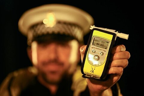 police-officer-with-a-drug-testing-device.jpg