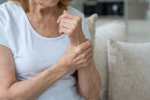 from-arthritis-hands-sitting-couch-concept-300x200.jpg