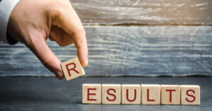 businessman-puts-blocks-with-word-results-300x157.jpg