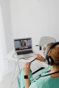 A doctor conducting a telemedicine appointment with a patient to prescribe medical cannabis in Germany.